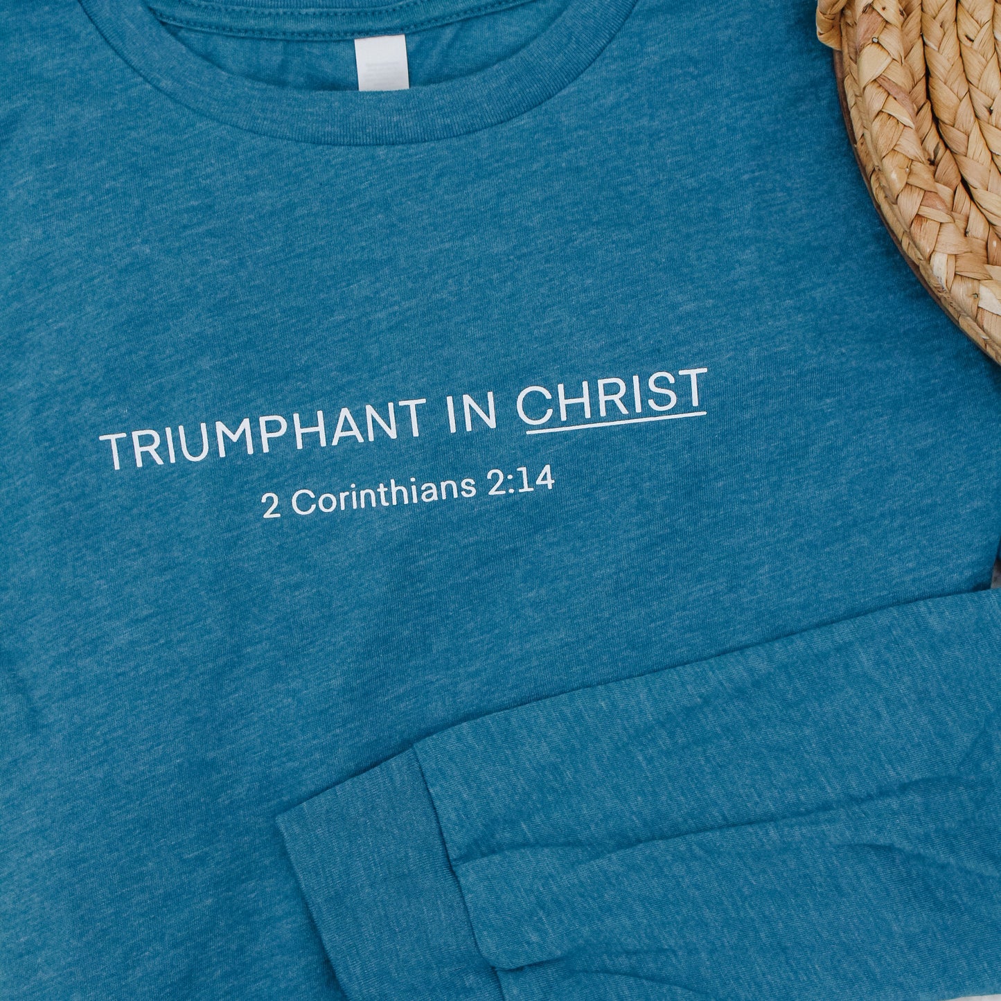 "Triumphant in Christ" UNISEX Long-Sleeve T-Shirt (Color: Heathered Teal)