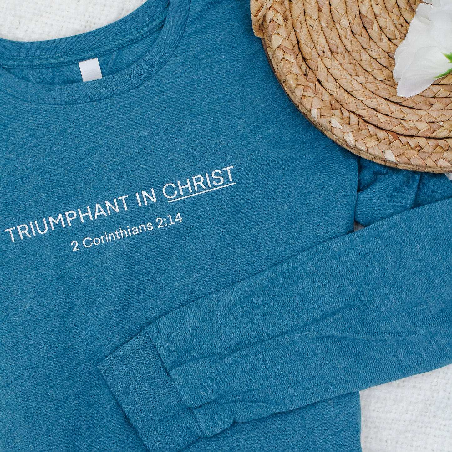 "Triumphant in Christ" UNISEX Long-Sleeve T-Shirt (Color: Heathered Teal)